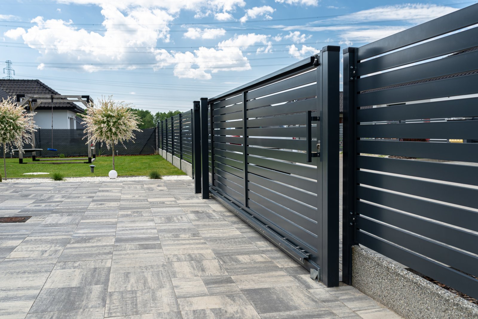modern metal fence and yard in suburban setting 2026 09 24 08 07 45 utc